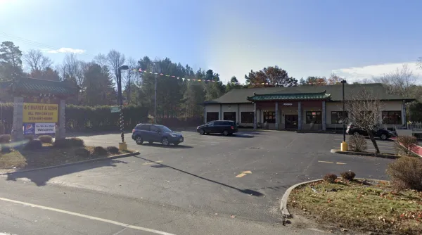 The exterior and large parking area at A-1 Buffet & Sushi
